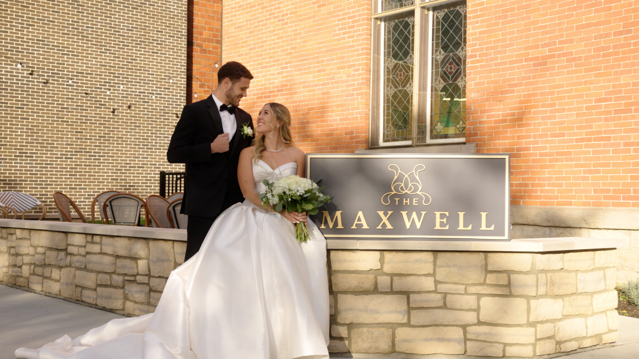 Couple by The Maxwell sign